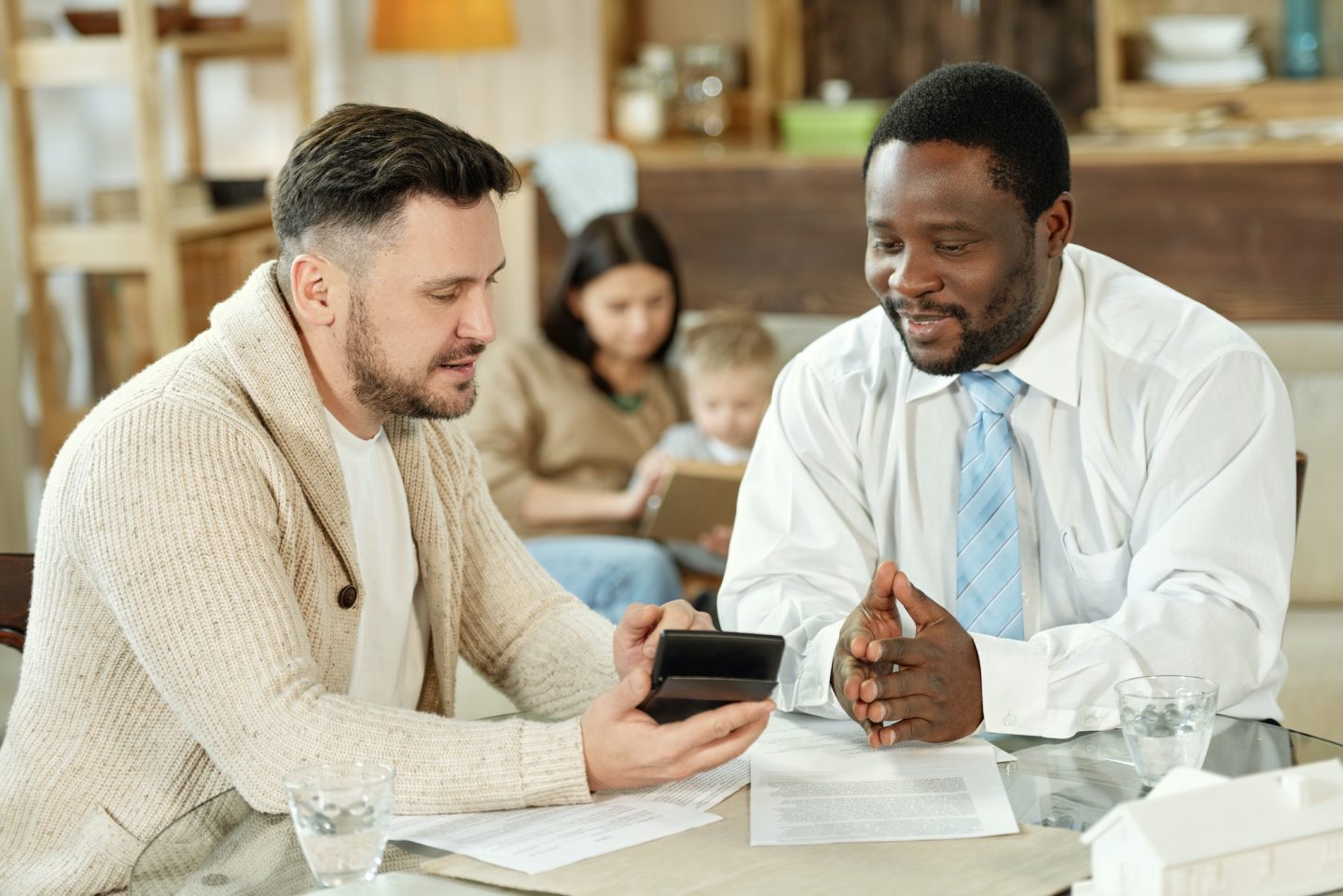 Ethnic man consulting client on home loan